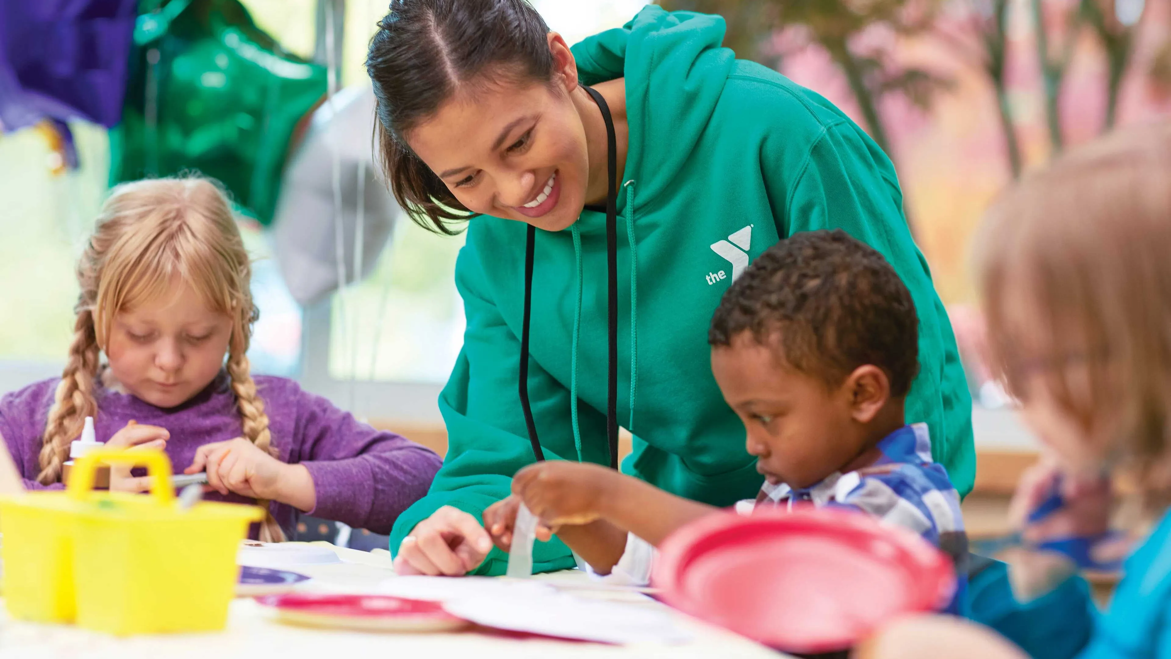 camp counselor crafting with kids