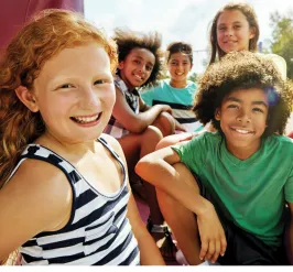 Group of smiling kids promoting Healthy Kids Day
